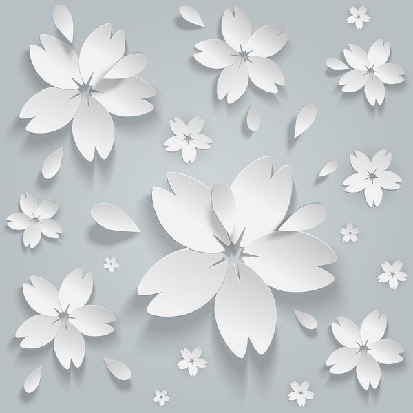 Белые бумажные цветы на сером фоне
