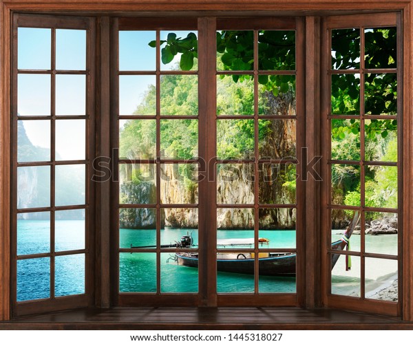 Деревянное окно и лодка у берега